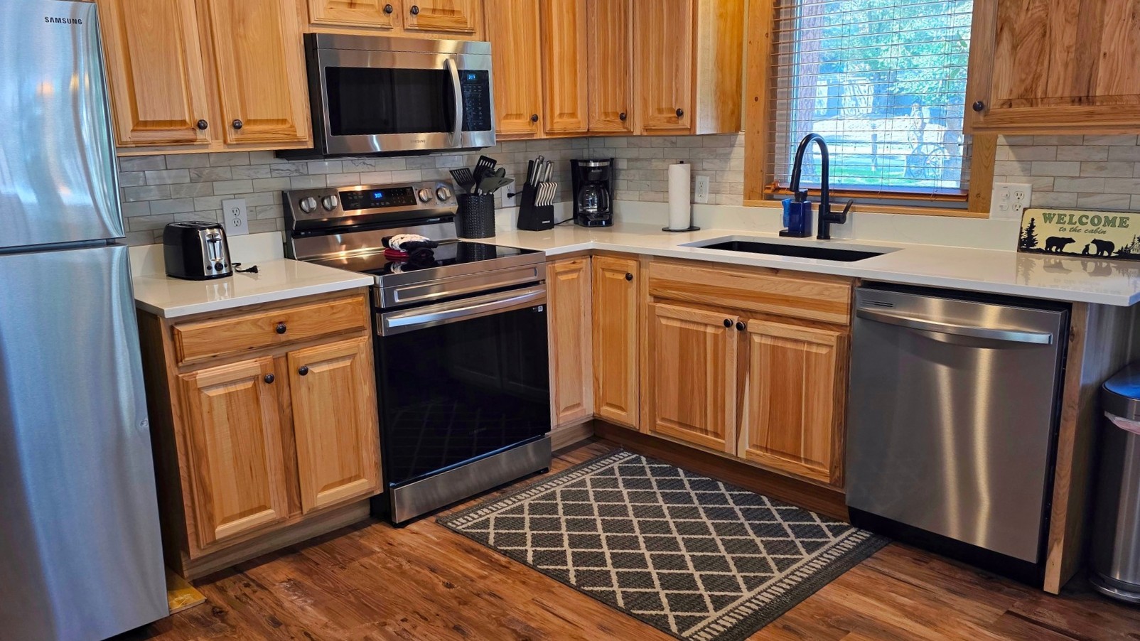 Fully stocked kitchen in a rental cabin at Fall River Cabins.